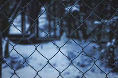 Full frame shot of chainlink fence against sky