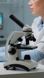 Cropped hand of scientist working in laboratory