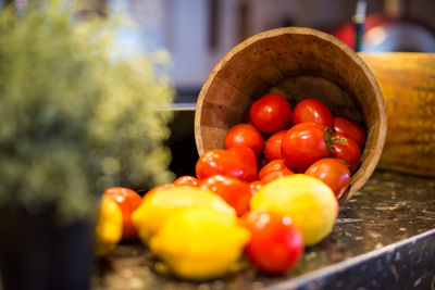 Close-up of fruits in container on table