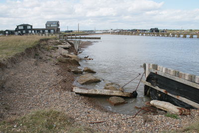 Landscape blyth estuary river water  walberswick by southwold crossing, fishing houses, huts, boats 