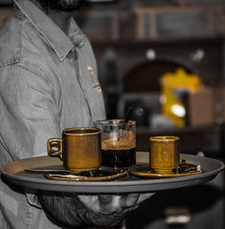 Close-up of hand with coffee