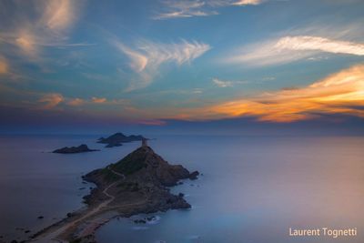 Scenic view of sea against sky at sunset