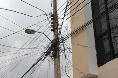 Low angle view of electricity pylon