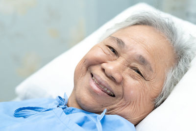 Portrait of smiling woman lying down