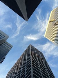 Low angle view of building against cloudy sky