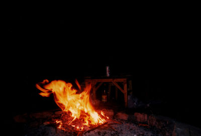 Close-up of bonfire against sky at night