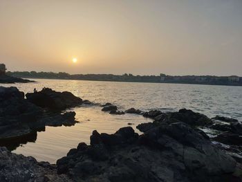 Scenic view of sea against sky during sunset