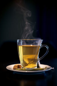 Close-up of coffee cup against black background