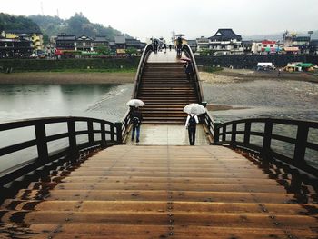 People walking on pier