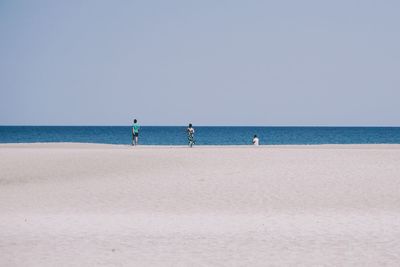 Scenic view of beach against clear sky