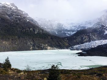 Scenic view of snowcapped mountains against sky