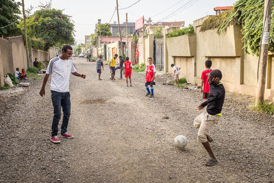 People playing soccer on field