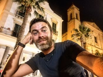 Portrait of man against building