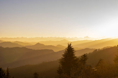 Scenic view of mountains against sky during sunset