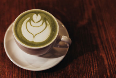 Close-up of cappuccino on table