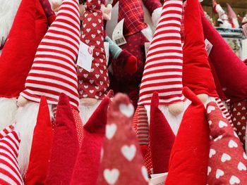 Low section of woman holding christmas decorations