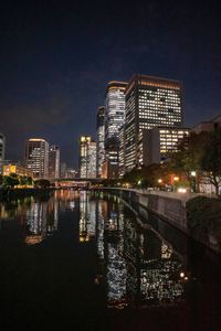 Illuminated buildings in city at night