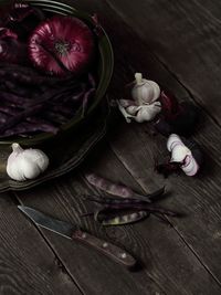 High angle view of purple roses on table