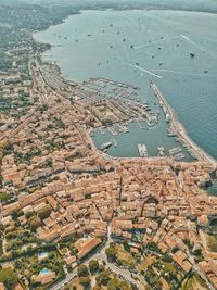 High angle view of cityscape by sea