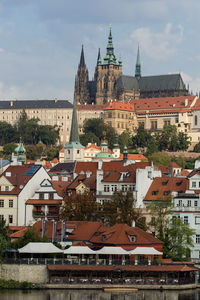 Buildings in city against sky