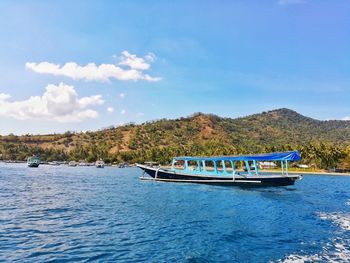 Boat in river against sky