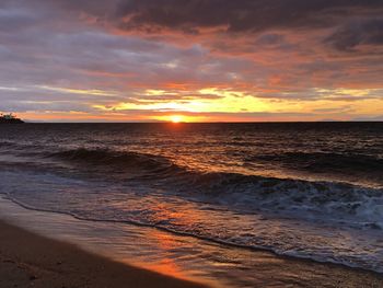 Scenic view of sea against sky during sunset