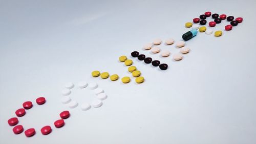 High angle view of multi colored pencils on white background