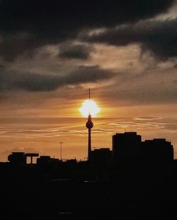 Silhouette of city at sunset