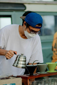 Midsection of man preparing food