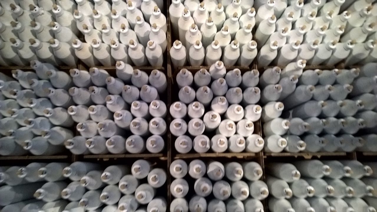 FULL FRAME SHOT OF STACK OF WHITE