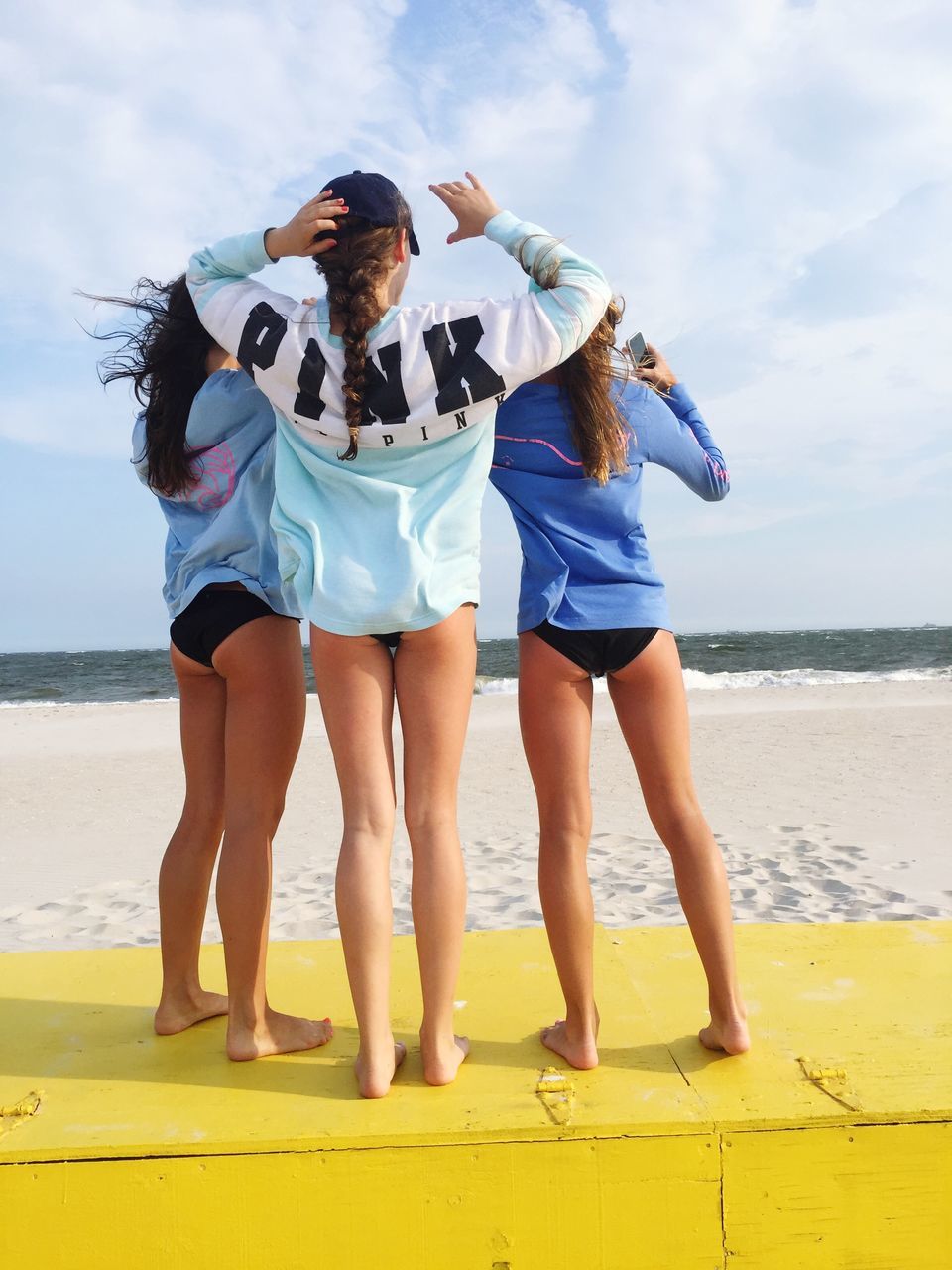 beach, sea, lifestyles, water, leisure activity, sky, full length, togetherness, horizon over water, bonding, standing, casual clothing, shore, sand, vacations, person, rear view, childhood