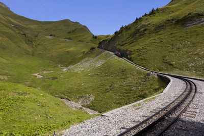 Scenic view of mountain road against clear sky