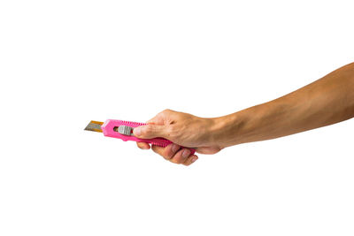 Close-up of hand holding hands over white background