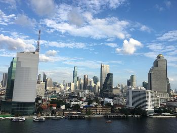 Modern buildings in city against sky