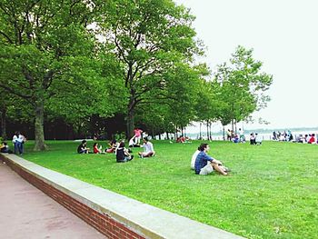 People relaxing in park