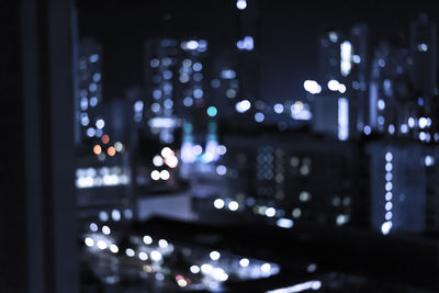 Defocused image of illuminated lights at night