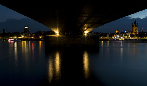 Illuminated city at waterfront