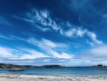 Scenic view of sea against blue sky