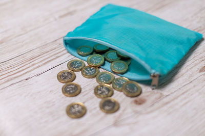 High angle view of coins on table