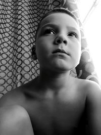 Portrait of shirtless boy at home