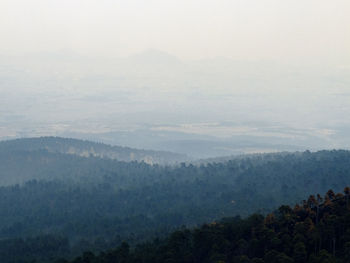 Scenic view of landscape against cloudy sky