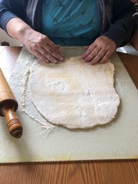 Midsection of woman preparing food on table