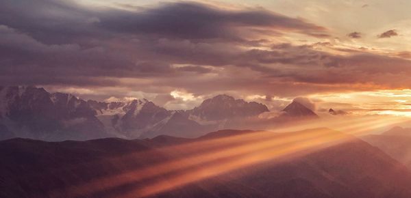 Scenic view of mountains against sky during sunset