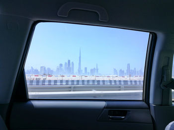 City seen through car window