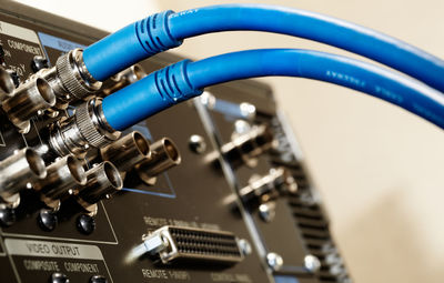 Close-up of blue cable connected to amplifier