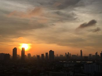 Cityscape against sky during sunrise