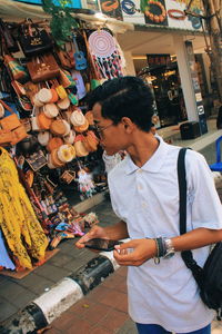 Woman standing at market stall