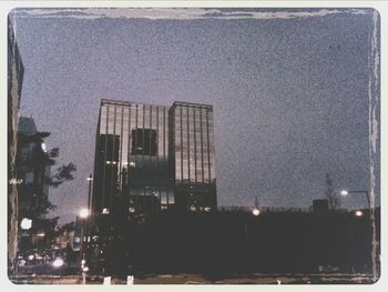 Illuminated buildings in city at night