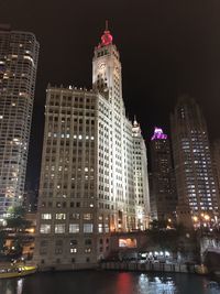 Illuminated buildings in city at night