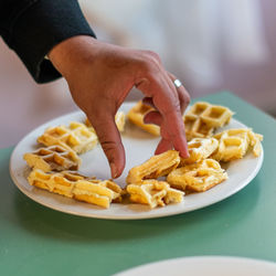 Cropped hand of person having food